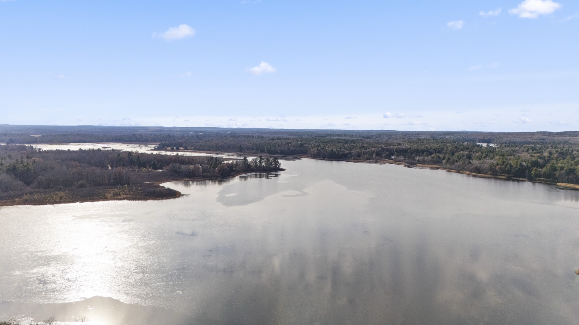 View of Long Lake Lodge from the lake showing waterfront and dock