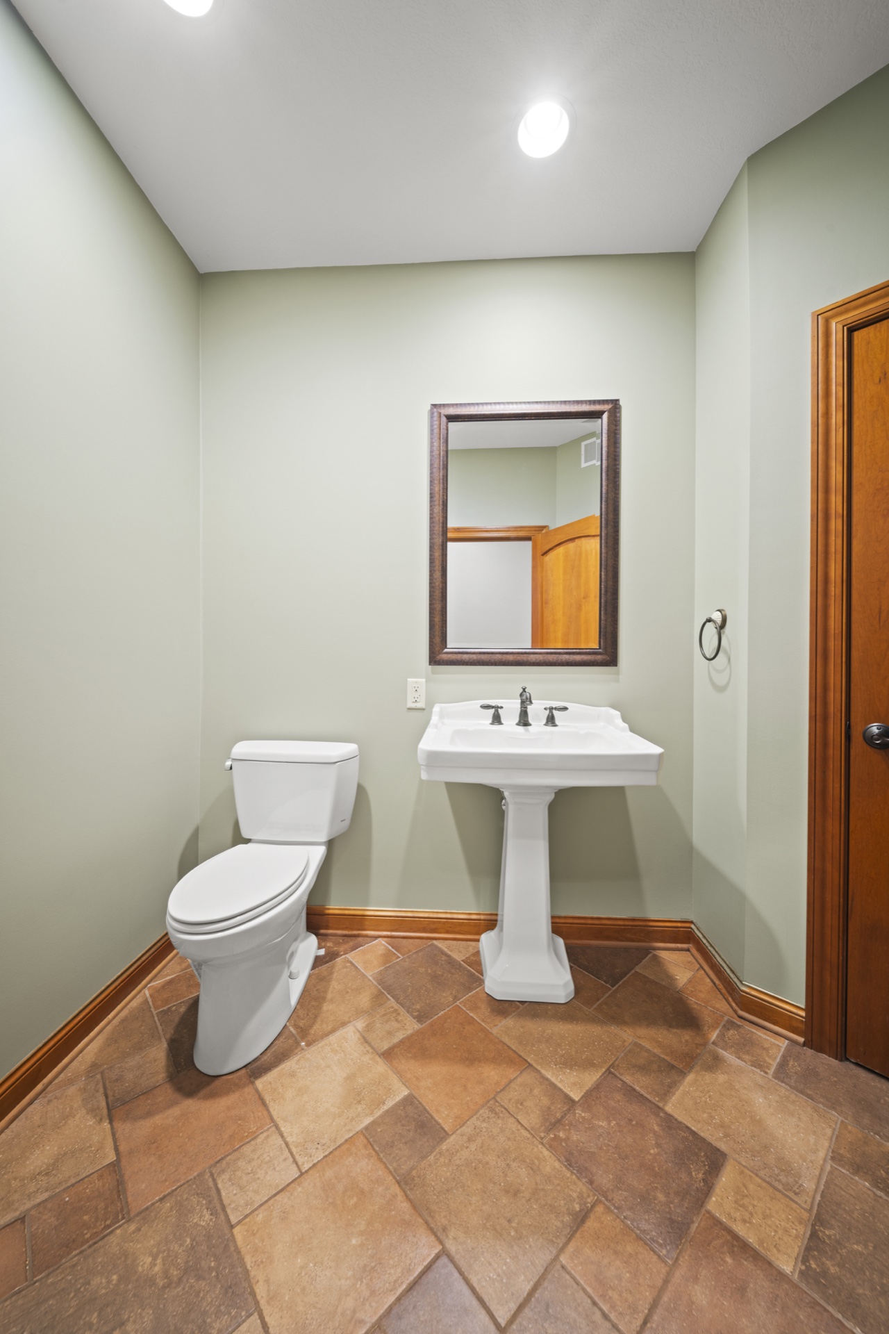 Upper level shared half bathroom with modern fixtures