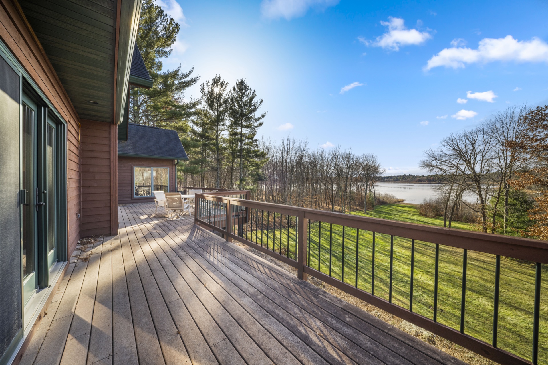 Upper level deck view overlooking Long Lake with seating area