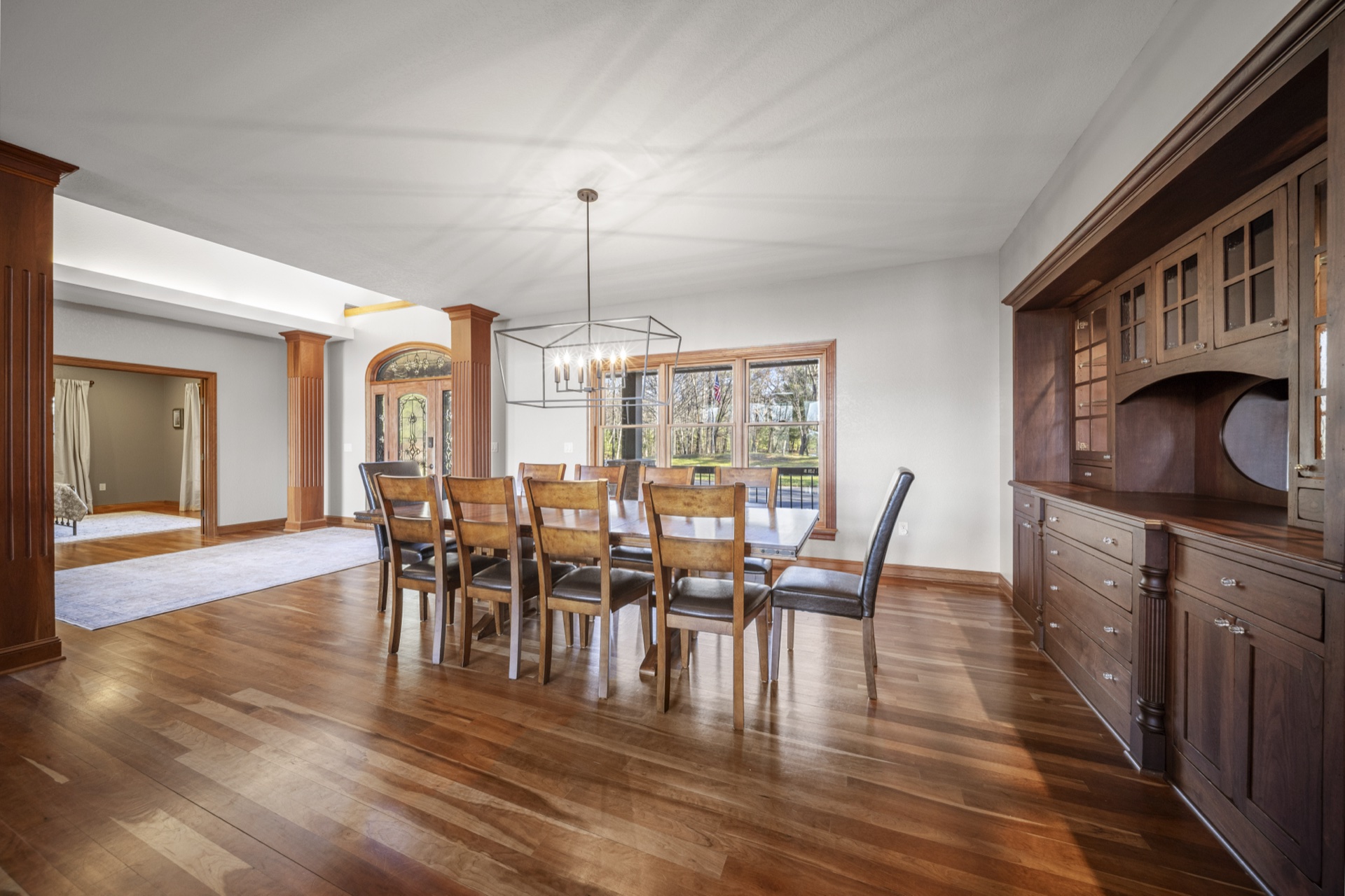 Formal dining room with seating for 8-10 guests and lake views