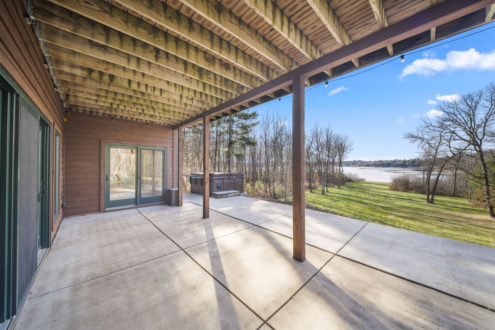 Lower level patio with lake views at The Long Lake Lodge