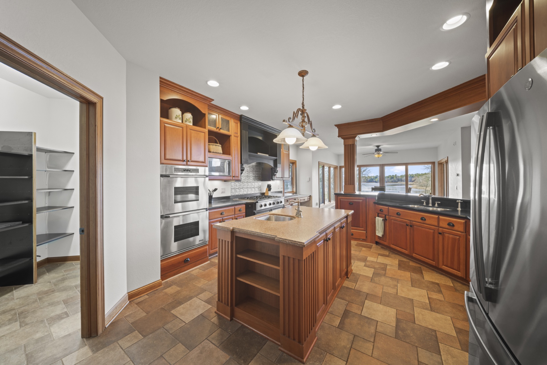 Gourmet kitchen with professional-grade appliances and large island at Long Lake Lodge