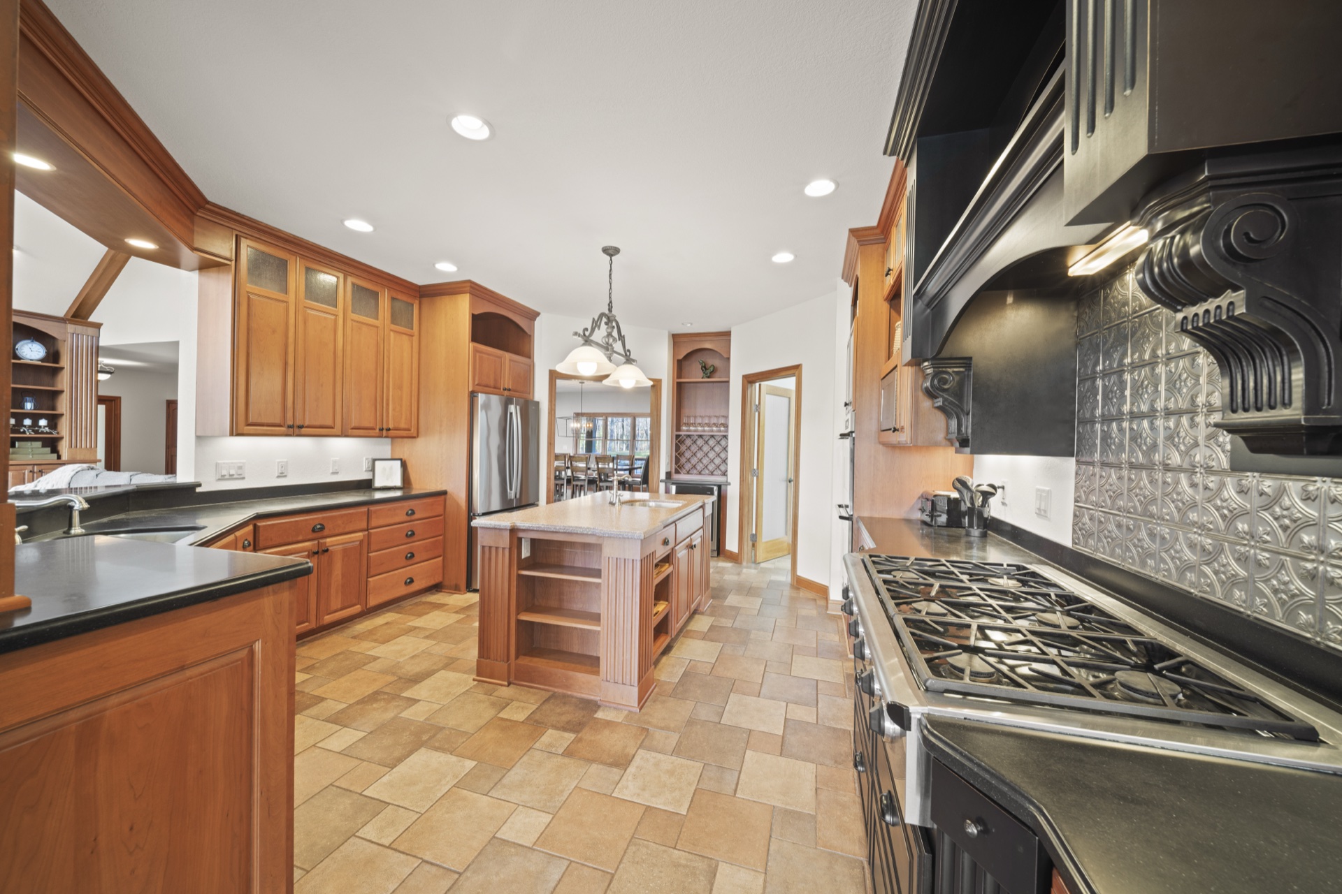 Alternate view of gourmet kitchen with custom cabinetry