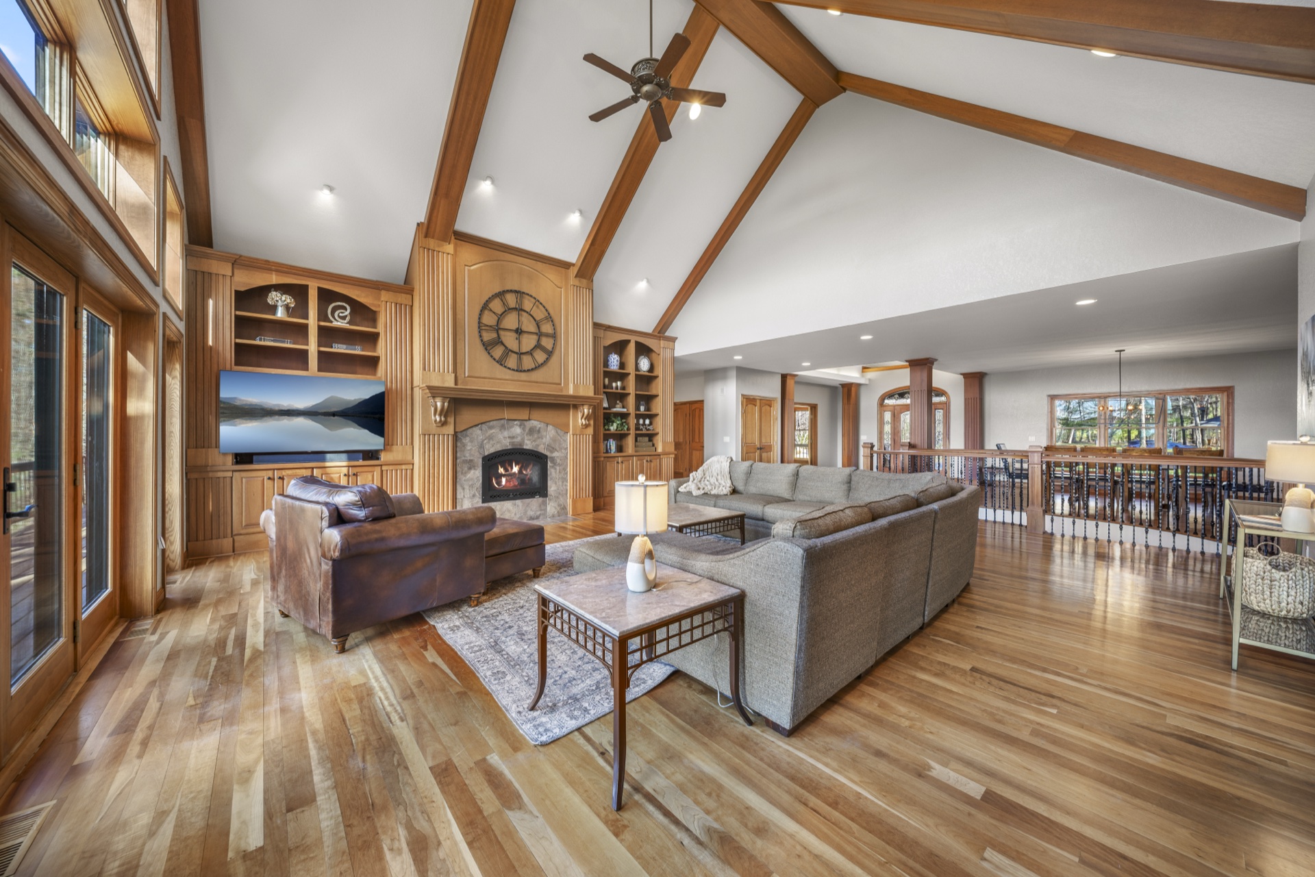Custom stone fireplace with built-in shelving and entertainment center