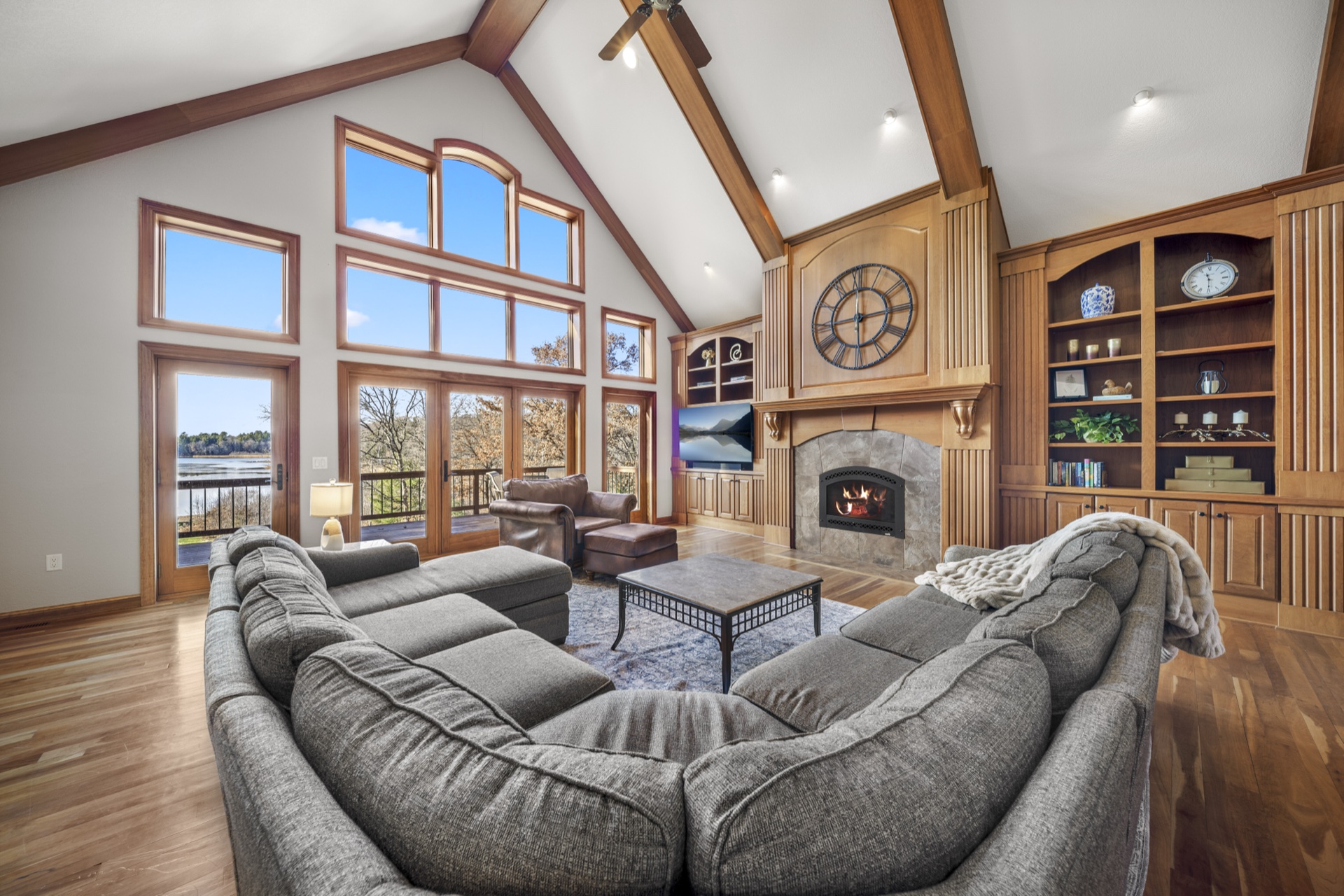 Floor-to-ceiling windows with panoramic Long Lake views from living room